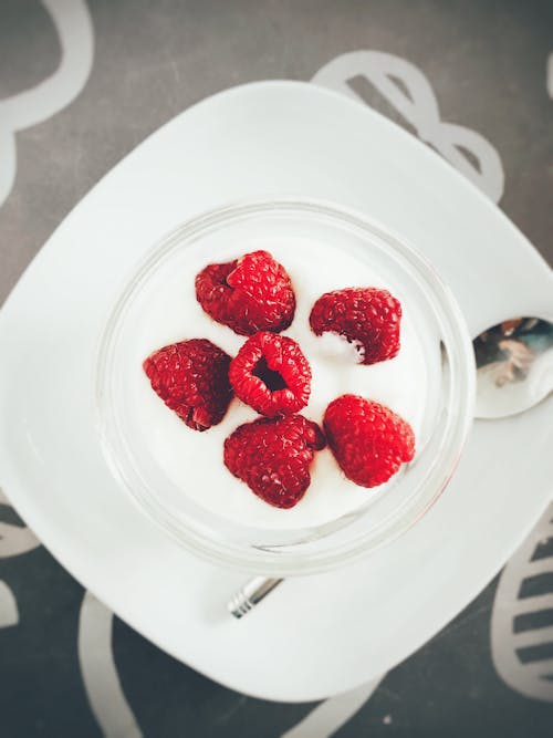 White Cream and Red Berries on Plate