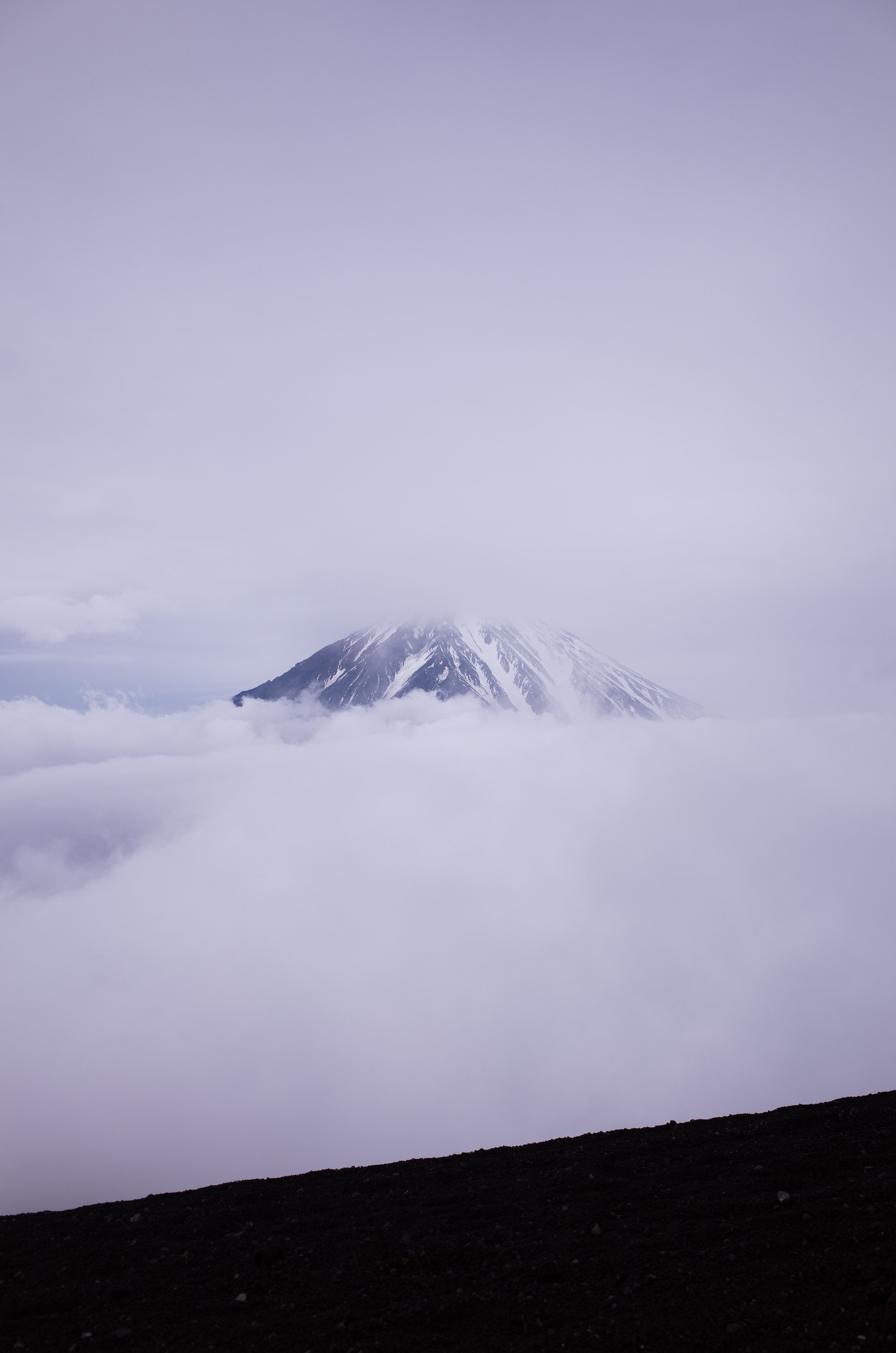 Snow Covered Mountain Under Cloudy Sky · Free Stock Photo