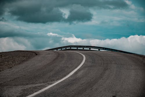 Empty Road Under the Cloudy Sky