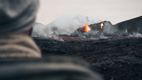A Person Watching a Volcanic Eruption