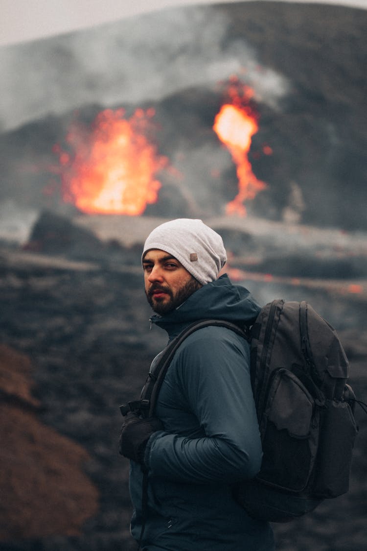 Man In Black Jacket Wearing Black Backpack