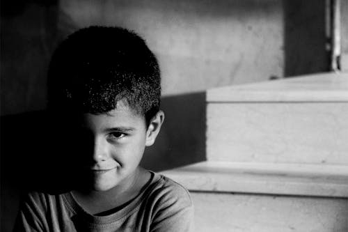 Free Black and White Photo of Little Boy Stock Photo