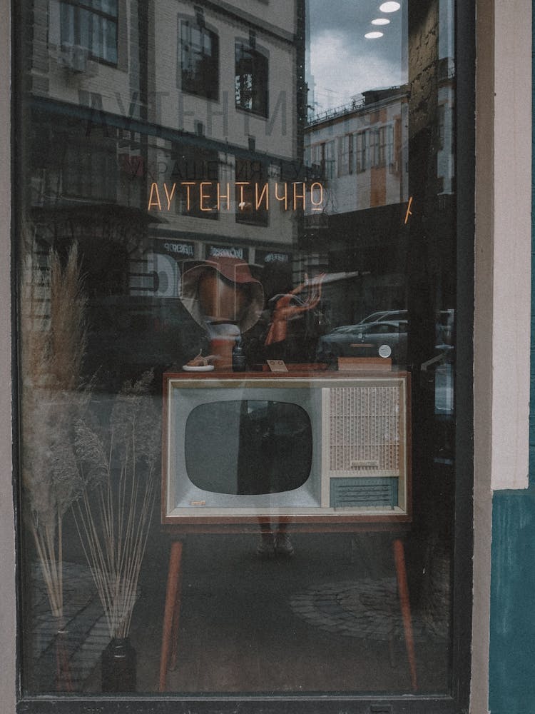 A Vintage Television Set On The Display Window