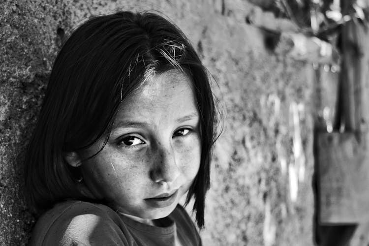 Grayscale Photo Of A Girl In Distress