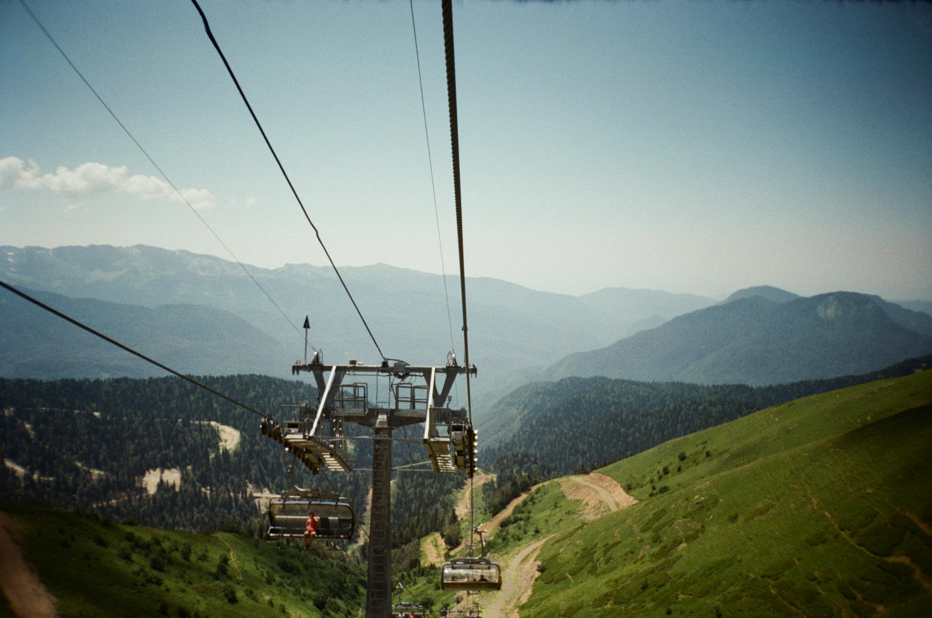 Free Scenic view of cable cars over lush mountains in Sochi, Russia. Stock Photo
