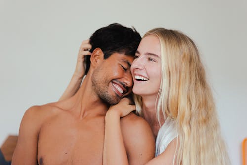 Free A Couple Smiling Together Stock Photo