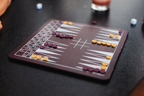 Close-up Shot of a Board Game on a Black Table