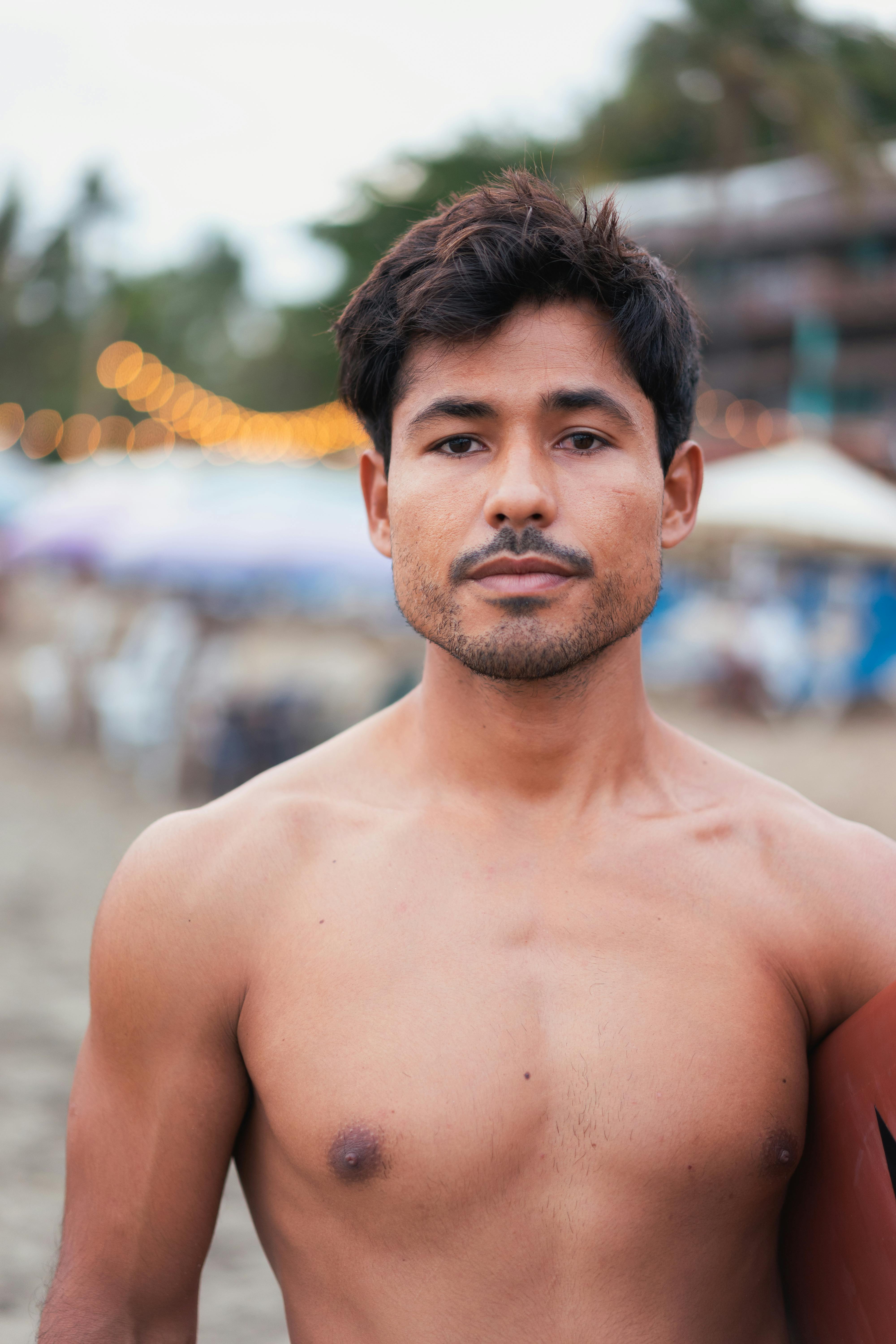 Topless Man Looking at Camera · Free Stock Photo