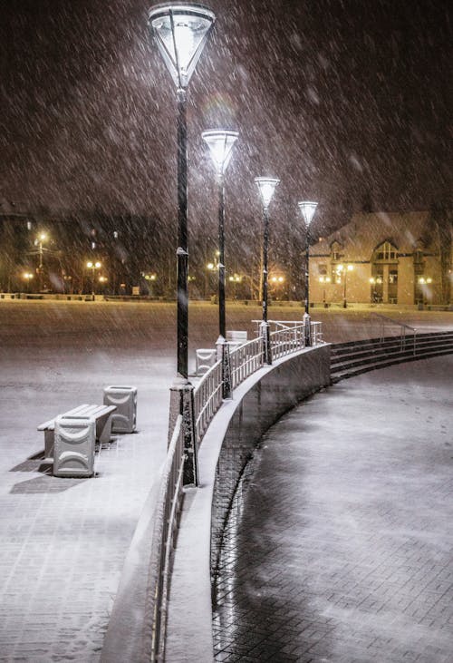 Snow Falling Over the Town's Park