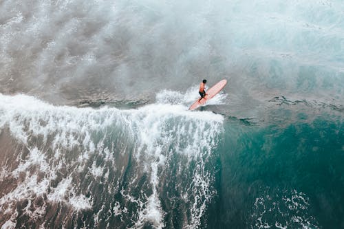 Top View of a Man Surfing on the Sea