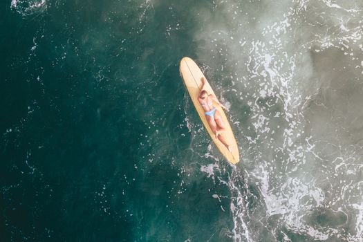 A Woman Surfing in the Sea