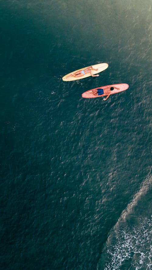 Drone Shot of a Couple Surfing 