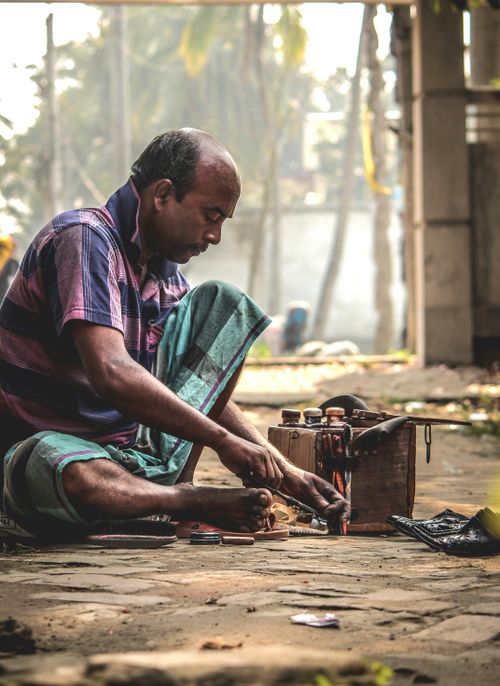 Free A focused craftsman works on a vintage tool set outdoors, showcasing traditional skills. Stock Photo