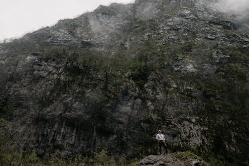 A Man Standing on a Rock