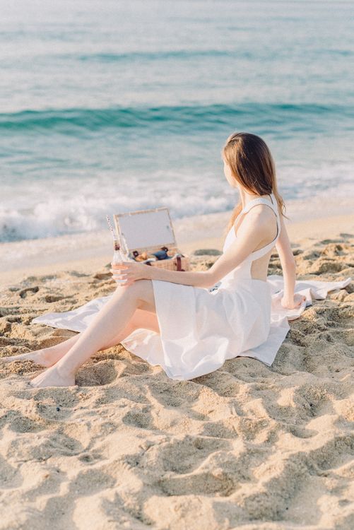 Woman in White Dress Sitting on Beach · Free Stock Photo
