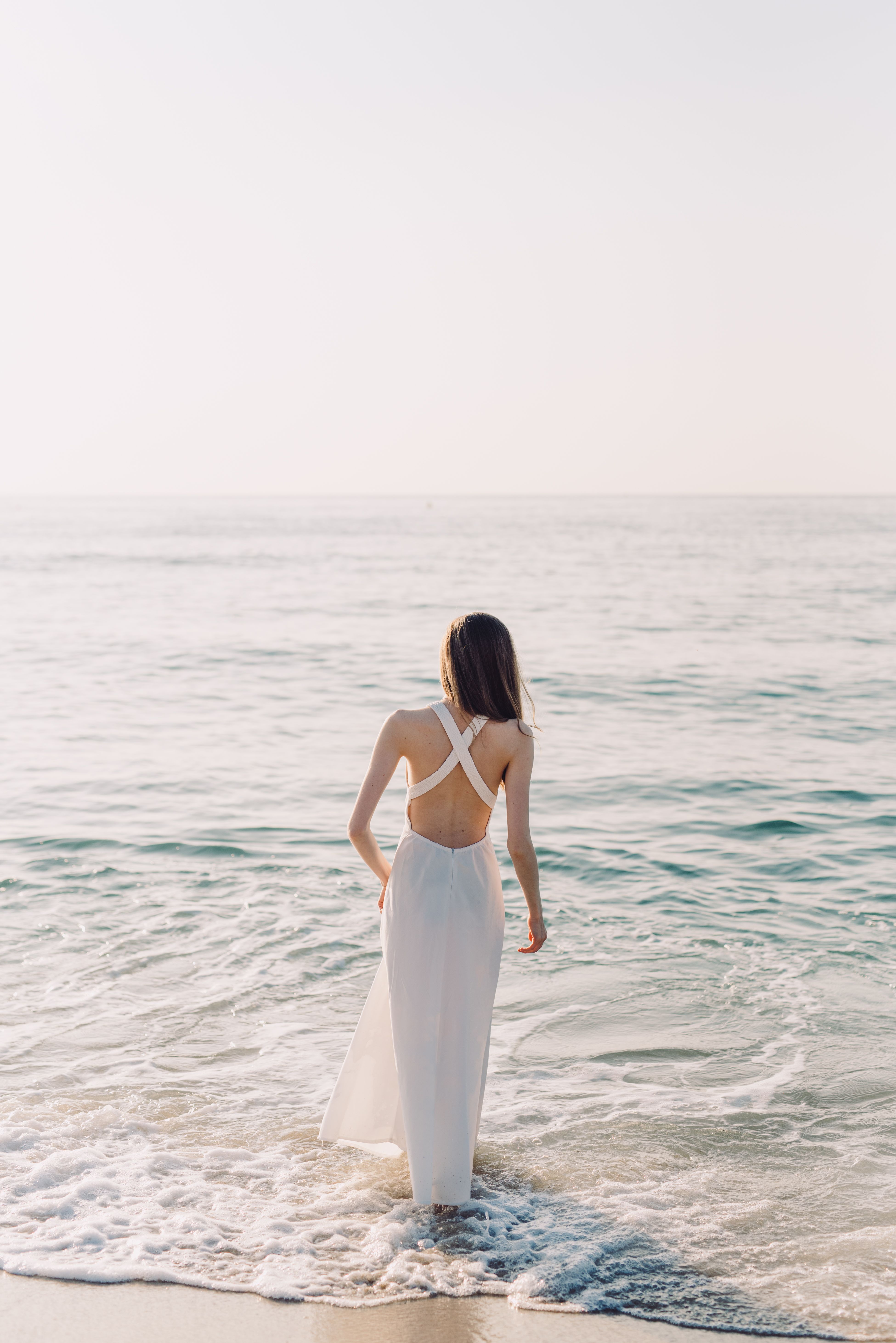 A Woman in White Dress Standing on Beach Water · Free Stock Photo