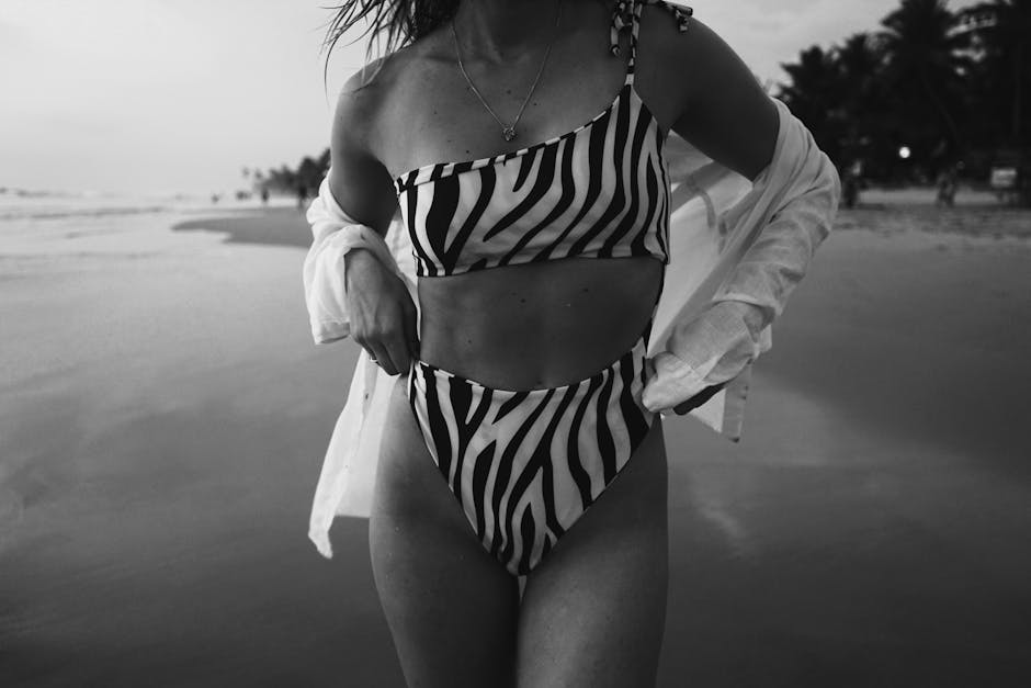 Woman in Black and White Bikini Standing on the Beach