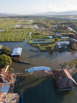 Stunning aerial view capturing the vibrant landscape and waterways of Inle Lake in Shan, Myanmar.