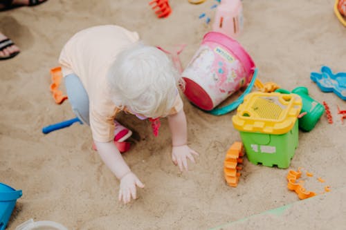 A Toddler Playing in the Sand