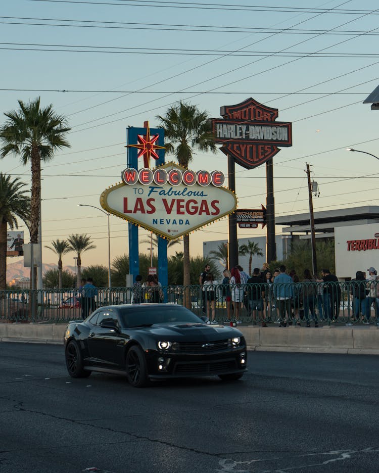 A Black Car On The Road In Las Vegas