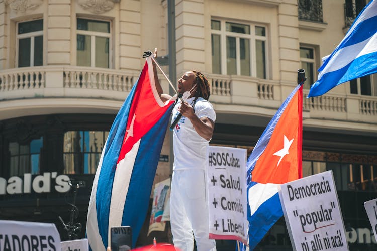 A Man Holding A Flag