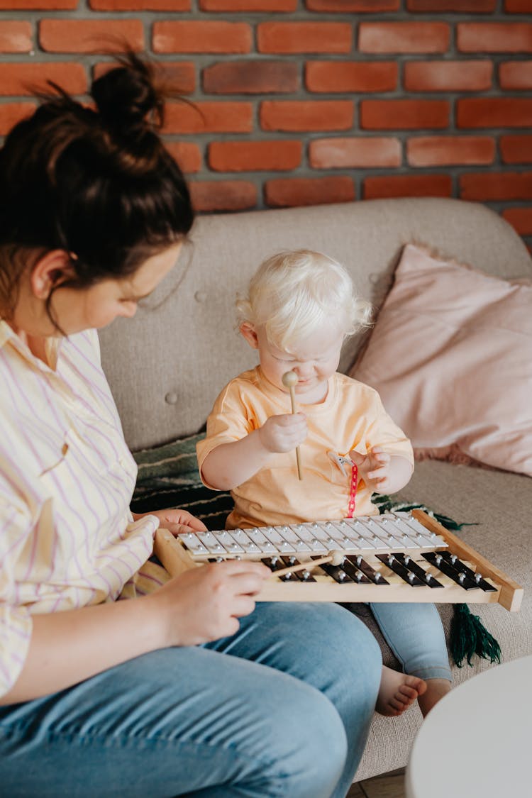 Toddler Playing With A Xylophone