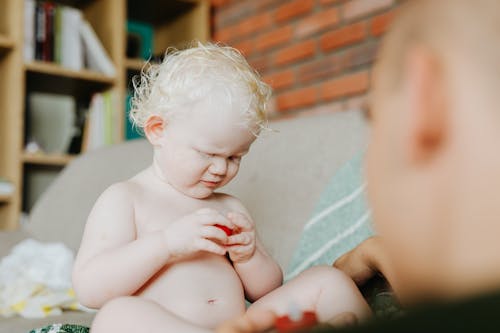 Close-Up Shot of a Topless Baby