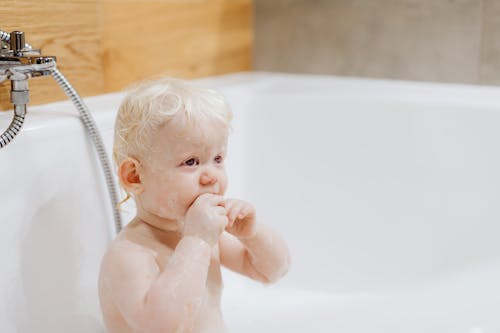 Free Close-Up Shot of a Topless Baby in the Bathtub Stock Photo