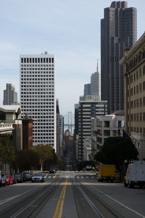 Free Urban view of San Francisco cityscape with prominent skyscrapers and street cars. Stock Photo