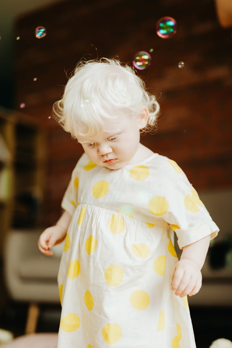 Girl In White And Yellow Polka Dot Dress