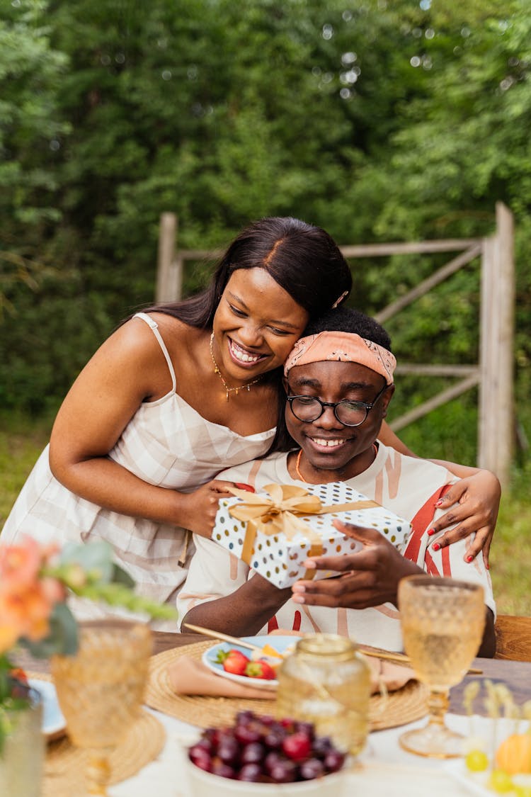 Smiling Couple Celebrating Birthday Outdoors