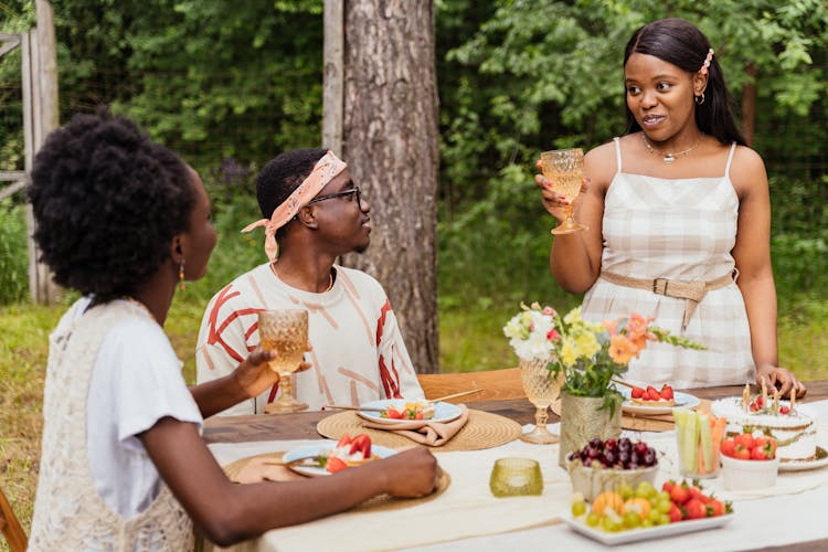 A Man And Women In A Outdoor Dining