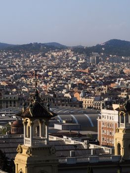A panoramic view showcasing the rooftops and landmarks of Barcelona from a high vantage point.