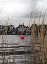 Gray Landscape with Red Buoy on a Lake