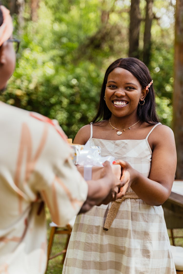 Smiling Woman While Receiving A Gift