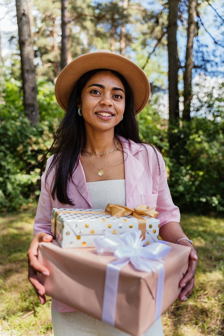 Woman Holding Big Wrapped Gift 