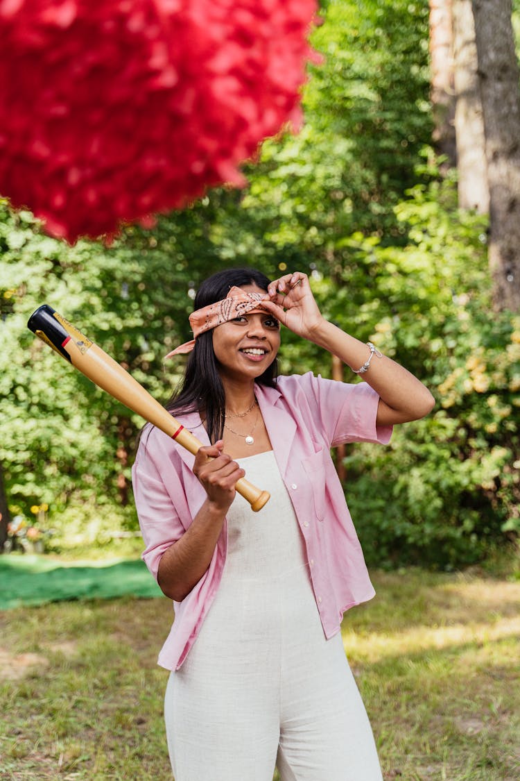 A Woman Holding A Baseball Bat