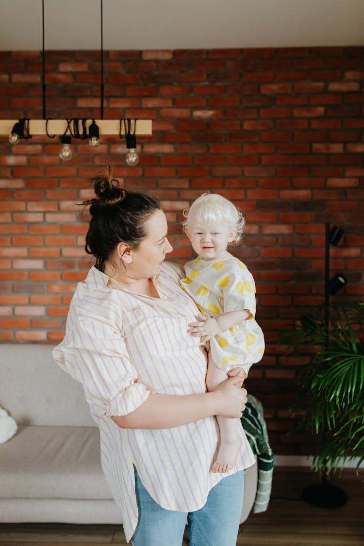 Woman Carrying Her Baby