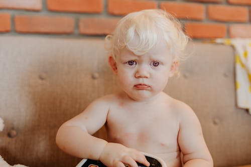 Close-Up Shot of a Topless Baby