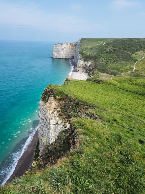 Free Breathtaking aerial view of the iconic cliffs and coastlines in Normandy, France. Stock Photo