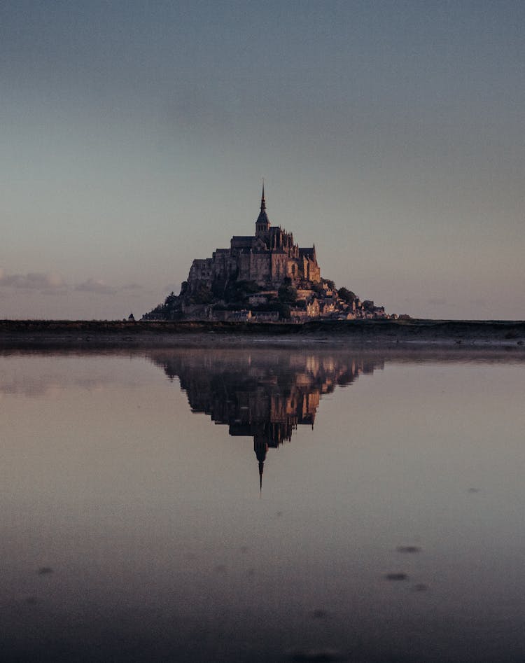 Castle On Island In Water On Horizon