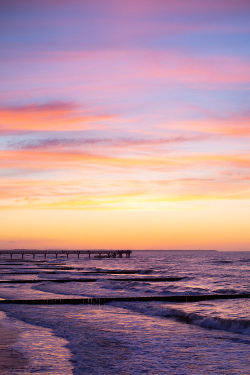 Free Captivating sunset over the ocean with waves at Zelenogradsk beach, Russia. Stock Photo
