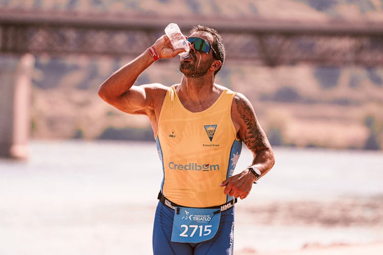 Runner Drinking Water During Race