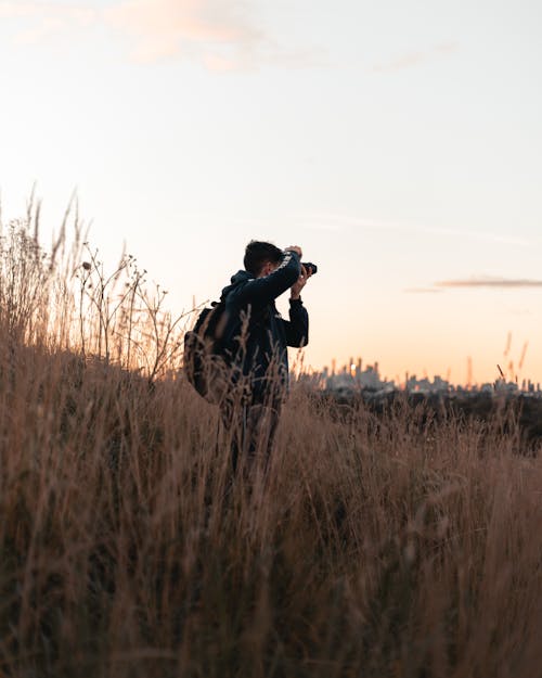 Man with a Backpack Taking Pictures