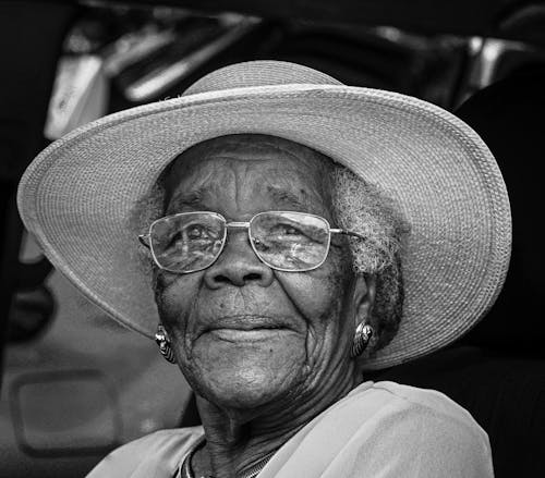 Grayscale Photo of an Elderly Woman