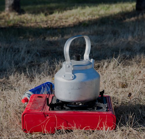 Free A Kettle over a Portable Stove Stock Photo