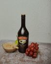 Black Glass Bottle on Brown Wooden Table