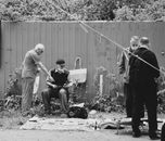 Elderly Men in a Street Sale