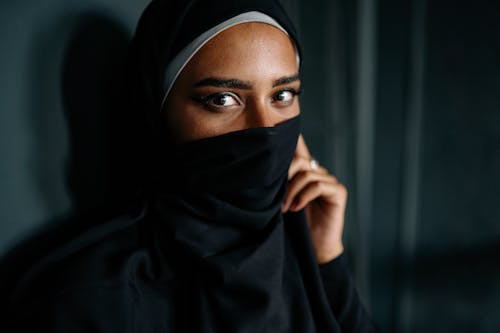 Free Woman in Black Hijab Covering Her Face  Stock Photo