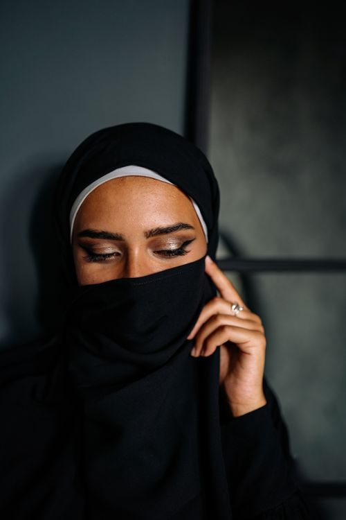 Free Graceful portrait showcasing a Muslim woman wearing a hijab, exuding elegance and poise. Stock Photo